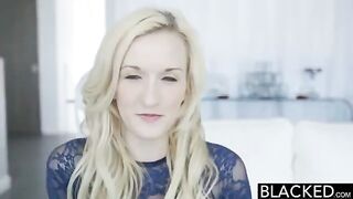 The blonde girl is fucking a black man while playing with a vibrator