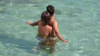 Girl fingers a guy underwater in the sea