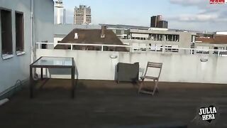 Brunette with big tits bounces on cock on the roof