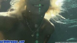 Blonde girl performs a blowjob underwater in the pool