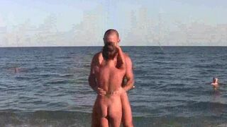 Nude beauties demonstrate their skills in acrobatics on the beach