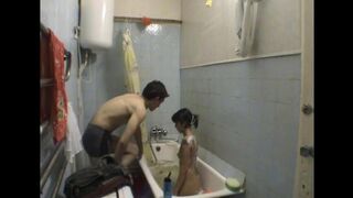 A girl has sex with her stepbrother in the bathroom, captured in a steamy scene