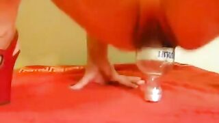 Fisting with a large dildo and a bottle, just like in the best eporn videos