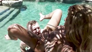 A relative has sex with a guy in the pool, showcasing fake tits