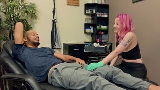 A tattooed woman is having fun with a black guy in an intense scene