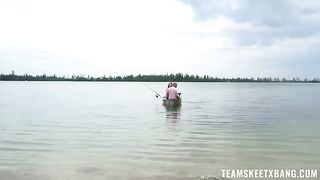 A man tried to catch a fish but got caught by a red-haired beauty