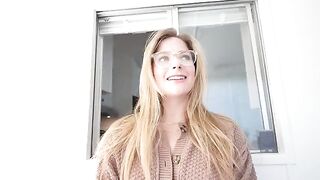 The blonde gets a huge load of cum on her face after sucking under the table