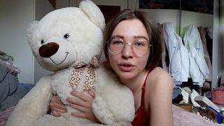A cute girl has a teddy bear as her best friend