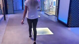 The girl is ready to do anything to close the deal in the mall