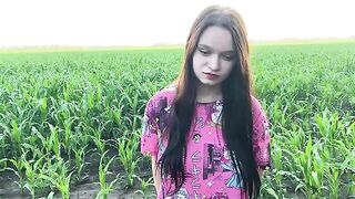A hot chick is having fun with a farmer in the field