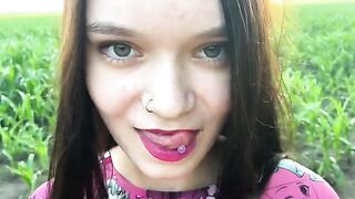 A hot chick is having fun with a farmer in the field