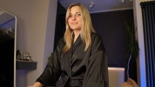 What is the surprise that her satin robe hides?