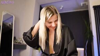 What is the surprise that her satin robe hides?
