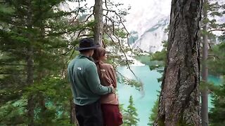A couple making love outdoors, caught up in the raw intimacy of nature
