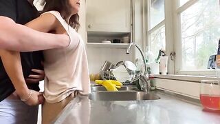 A mature woman with big tits gets fucked in the kitchen, a steamy homemade scene