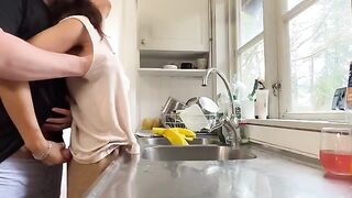 A mature woman with big tits gets fucked in the kitchen, a steamy homemade scene