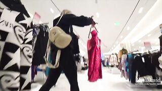 Babe almost gets caught while giving a blowjob in the fitting room
